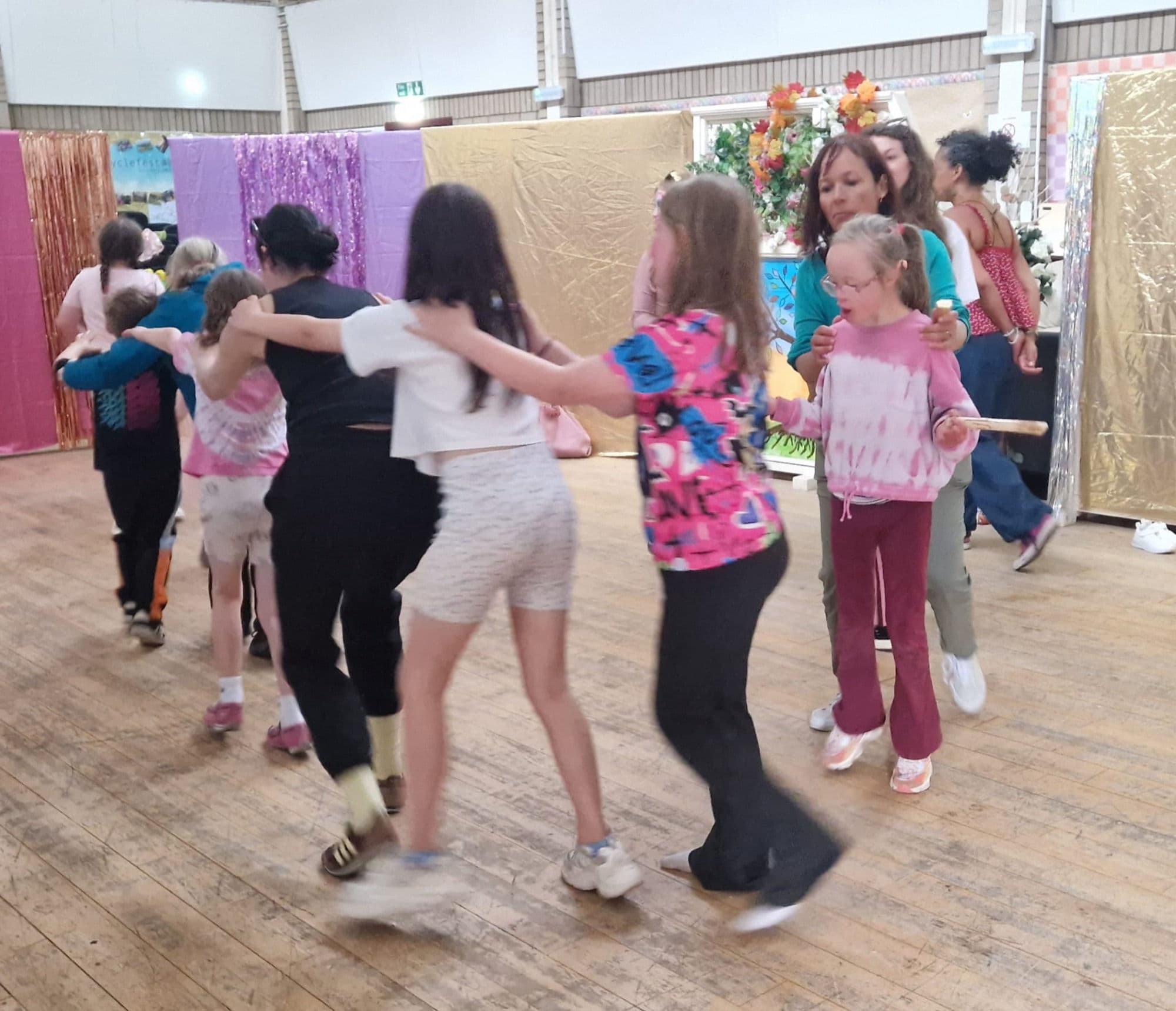 A conga line winding across the family disco dance floor.